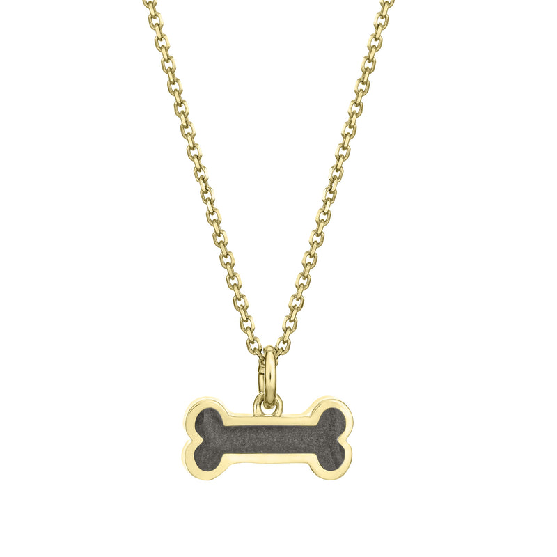 Pictured here is the Dog Bone Memorial Cremation Pendant in 14K Yellow Gold, designed by close by me jewelry, from the front