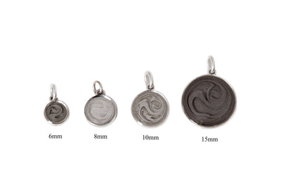 All four sizes of sterling silver dome pendant with ashes designed by close by me jewelry labeled from smallest to largest