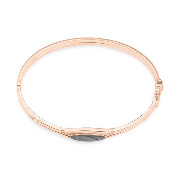 Overhead view of Double Band Oval Bangle Cremation Bracelet in 14K Rose Gold against a white background.