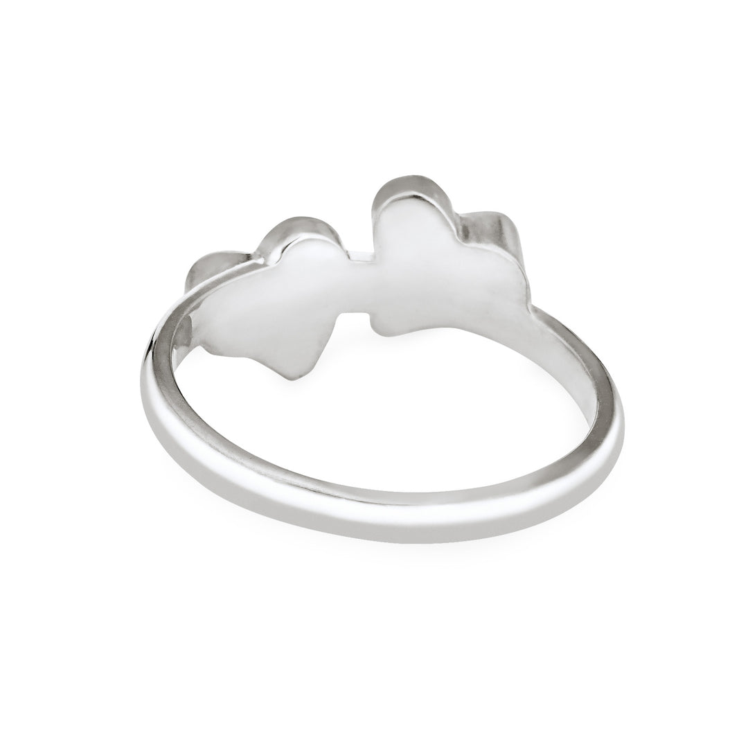 Back view of Close By Me's Sterling Silver Double Heart Cremation Ring, floating against a white backdrop.
