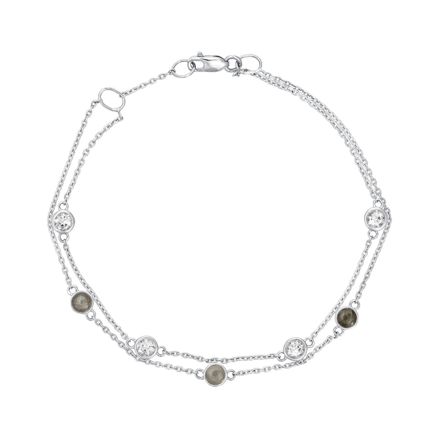 Close By Me's Double Strand Cremation Bracelet in 14K White Gold laid flat in a circular, closed position with the strand of four white topazes resting parallel atop the strand of three ash-filled charms.
