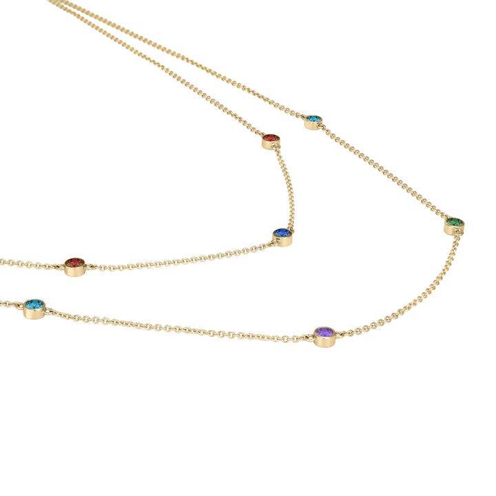 Side view of Close By Me's Double Strand Birthstone Necklace in 14K Yellow Gold, set with 7 different gemstones.