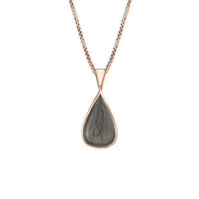 This photo shows the Fancy Bail Teardrop Pendant in 14K Rose Gold designed and set with ashes by close by me jewelry from the front