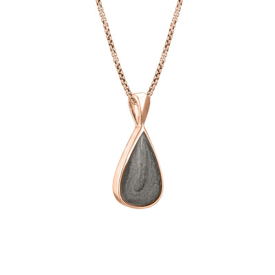 This photo shows the Fancy Bail Teardrop Pendant in 14K Rose Gold designed and set with ashes by close by me jewelry from the side
