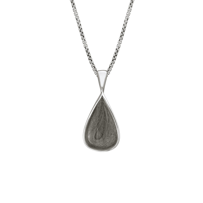 This photo shows the Fancy Bail Teardrop Cremation Pendant in Sterling Silver designed and set with ashes by close by me jewelry from the front