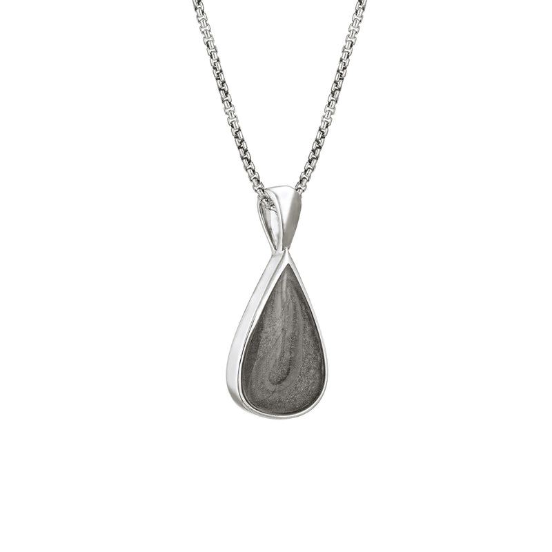 This photo shows the Fancy Bail Teardrop Cremation Pendant in Sterling Silver designed and set with ashes by close by me jewelry from the side