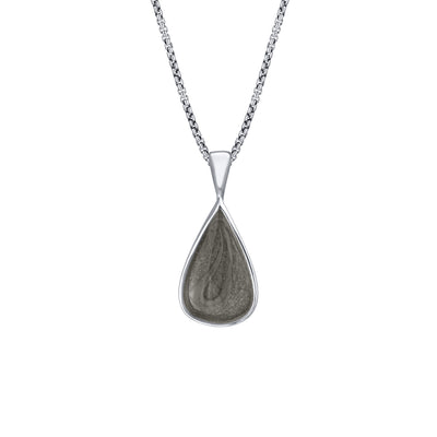 This photo shows the Fancy Bail Teardrop Cremation Pendant in 14K White Gold designed and set with ashes by close by me jewelry from the front