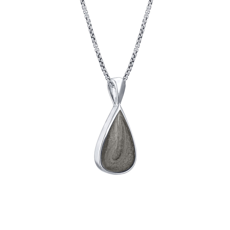 This photo shows the Fancy Bail Teardrop Cremation Pendant in 14K White Gold designed and set with ashes by close by me jewelry from the side