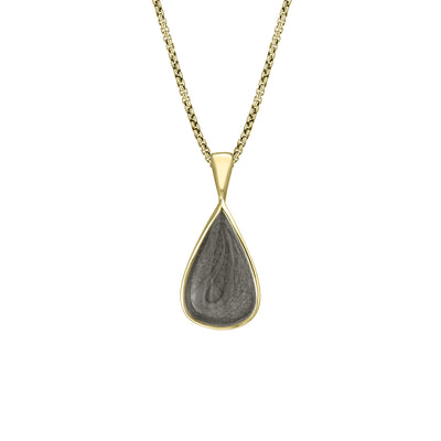 This photo shows the Fancy Bail Teardrop Cremation Pendant in 14K Yellow Gold designed and set with ashes by close by me jewelry from the front
