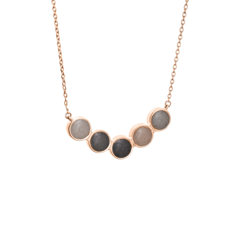 Pictured here is the Five Setting Chevron Cremated Remains Necklace in 14K Rose Gold and set with ashes by close by me jewelry from the side