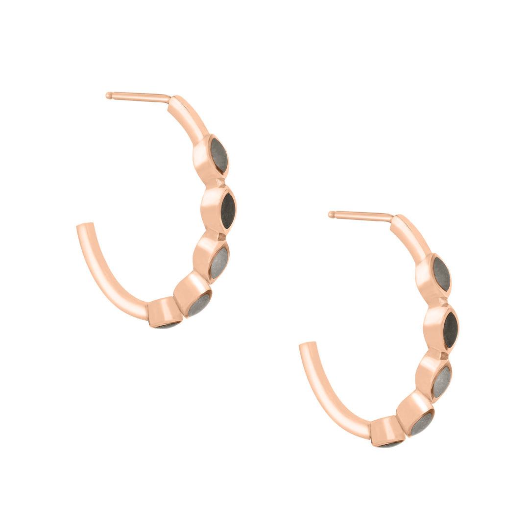 side and partial front view of close by me's 14k rose gold five setting open hoop cremation earrings