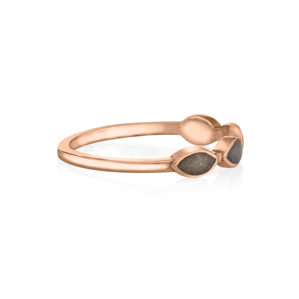 side view of close by me's 14k rose gold cremation ring with four marquise-shaped ash settings