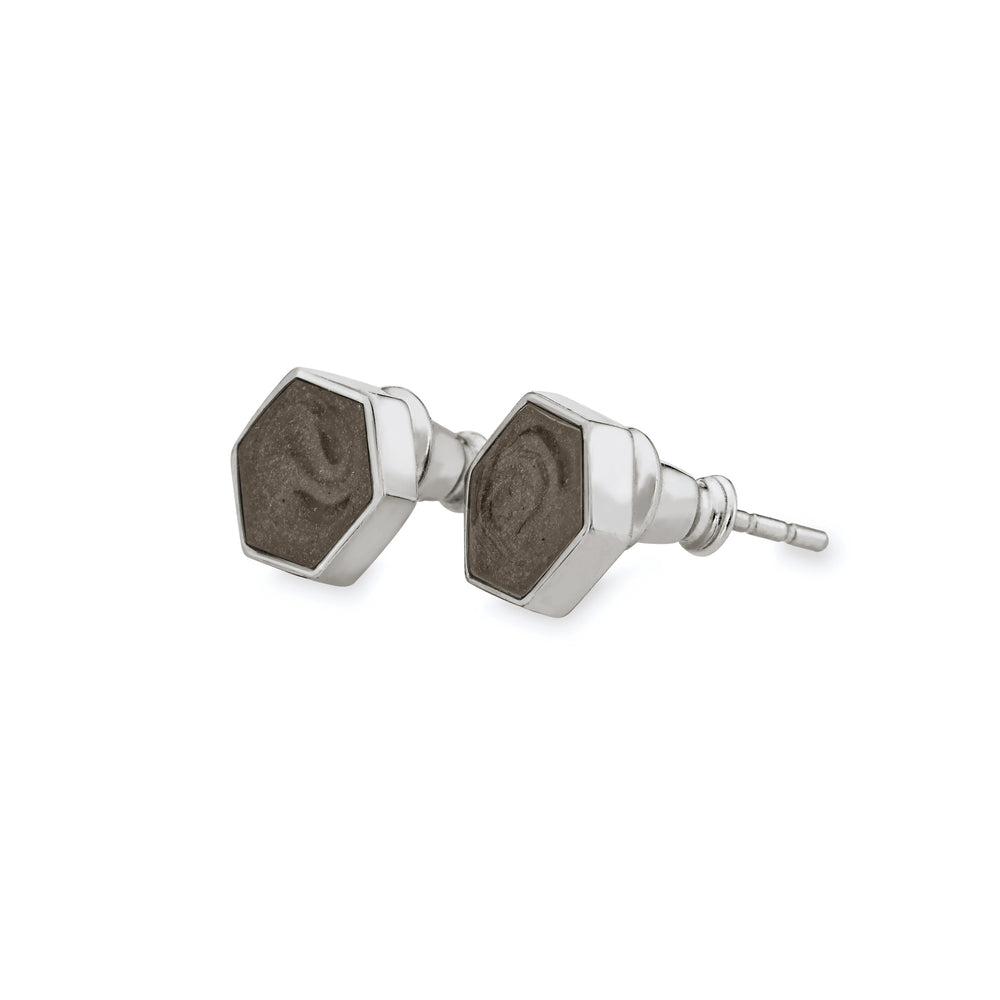 Hexagon stud cremation earrings in sterling silver featuring solidified ashes shown from the side