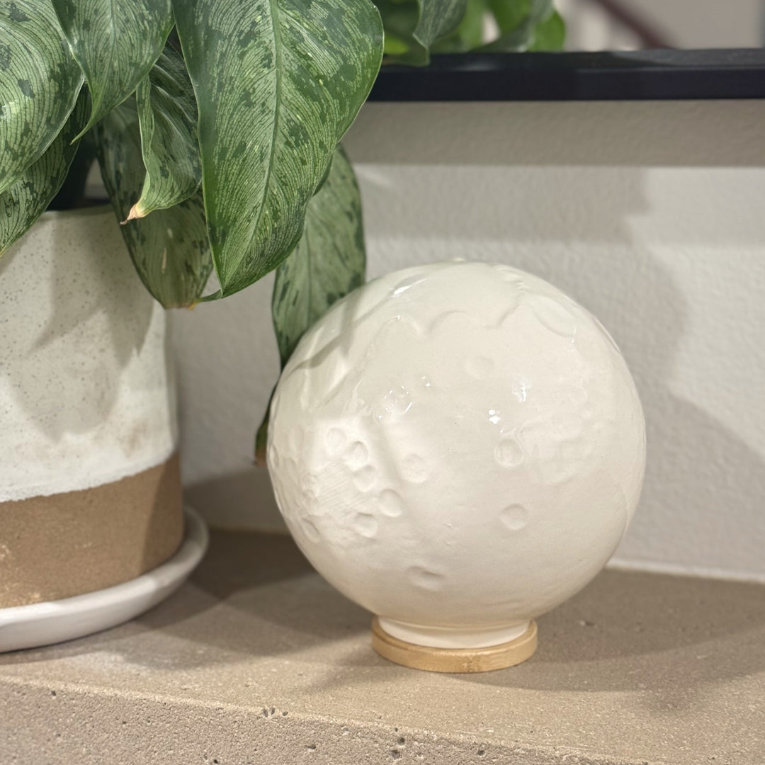 CeramicMoonUrnOnMantle