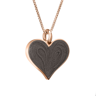 The 14k rose gold large heart pendant with ashes by close by me jewelry from an angle