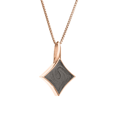 A close-up side view of Close By Me Jewelry's Large Luminary Cremation Pendant in 14K Rose Gold, set against a solid white background.