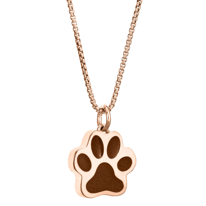 This photo shows the Large Paw Print Pendant with ashes design set with ashes in 14K Rose Gold by close by me jewelry from the side