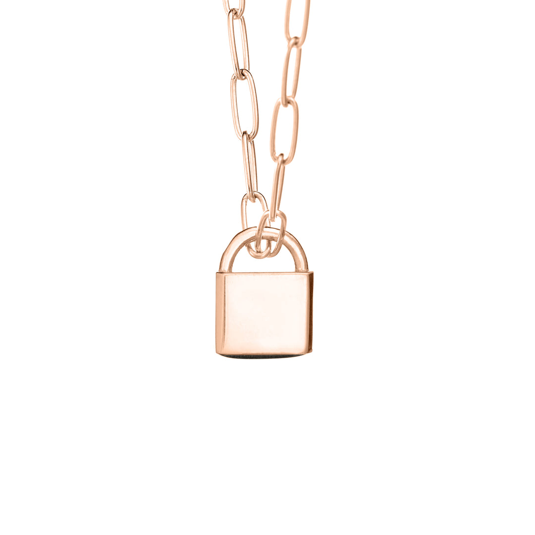 A Lock-style Cremation Necklace with a Stylized Chain with a capital "G" engraved on its front in 14K Rose Gold by close by me jewelry from the back
