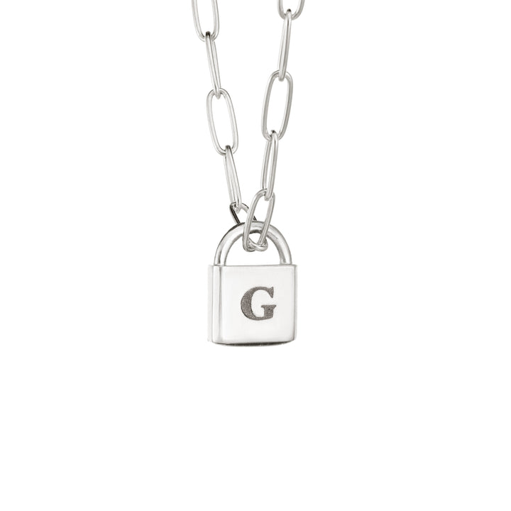 A Lock-style Cremation Necklace with a Stylized Chain with a capital "G" engraved on its front in Sterling Silver by close by me jewelry from the side