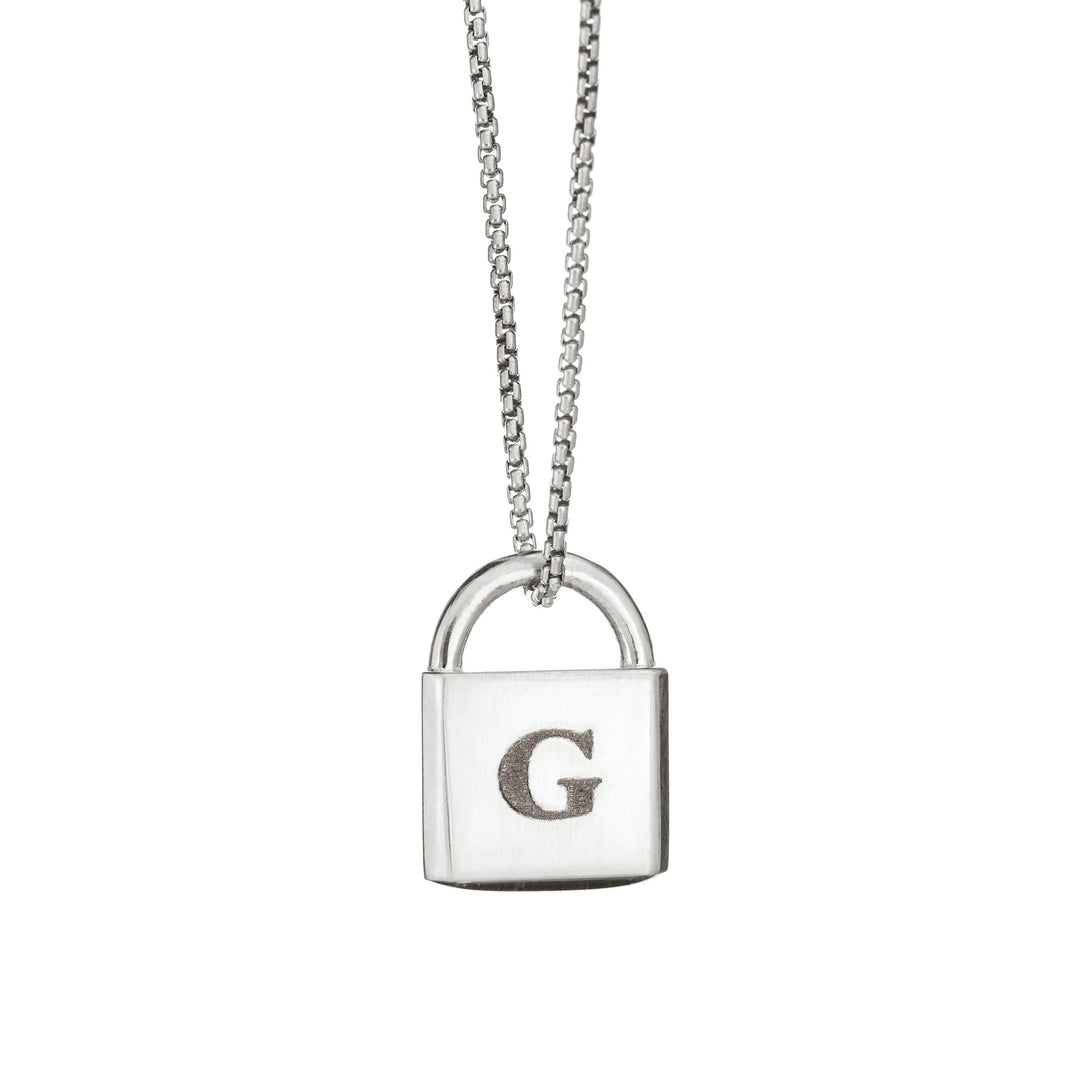 A Lock-style Cremation Pendant with a capital "G" engraved on its front in Sterling Silver by close by me jewelry from the front