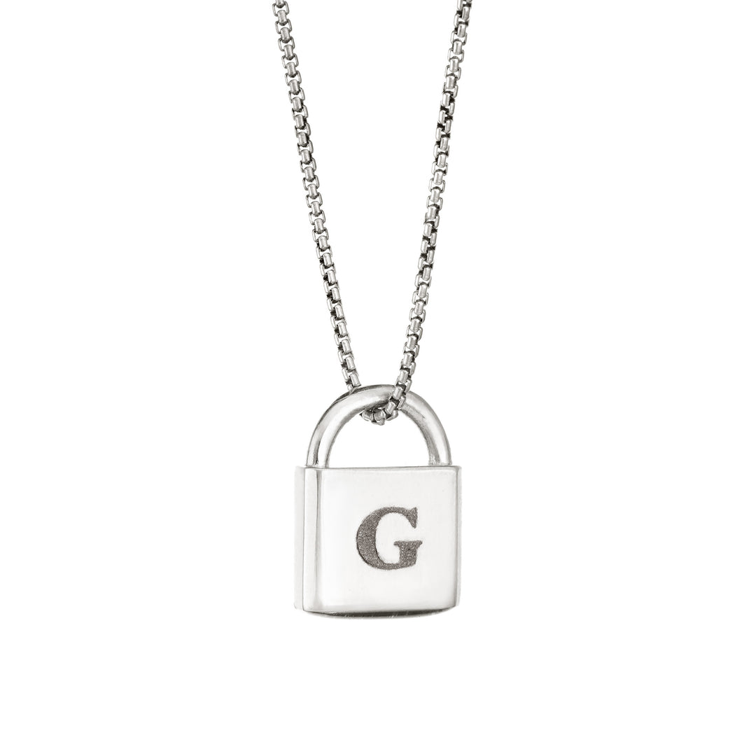 A Lock-style Cremation Pendant with a capital "G" engraved on its front in Sterling Silver by close by me jewelry from the side