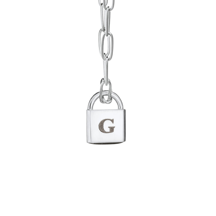 A Lock-style Cremated Remains Necklace with a Stylized Chain with a capital "G" engraved on its front in 14K White Gold by close by me jewelry from the front