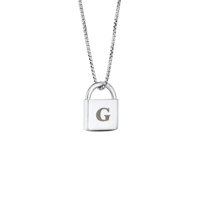 A Lock-style Cremains Pendant with a capital "G" engraved on its front in 14K White Gold by close by me jewelry from the side