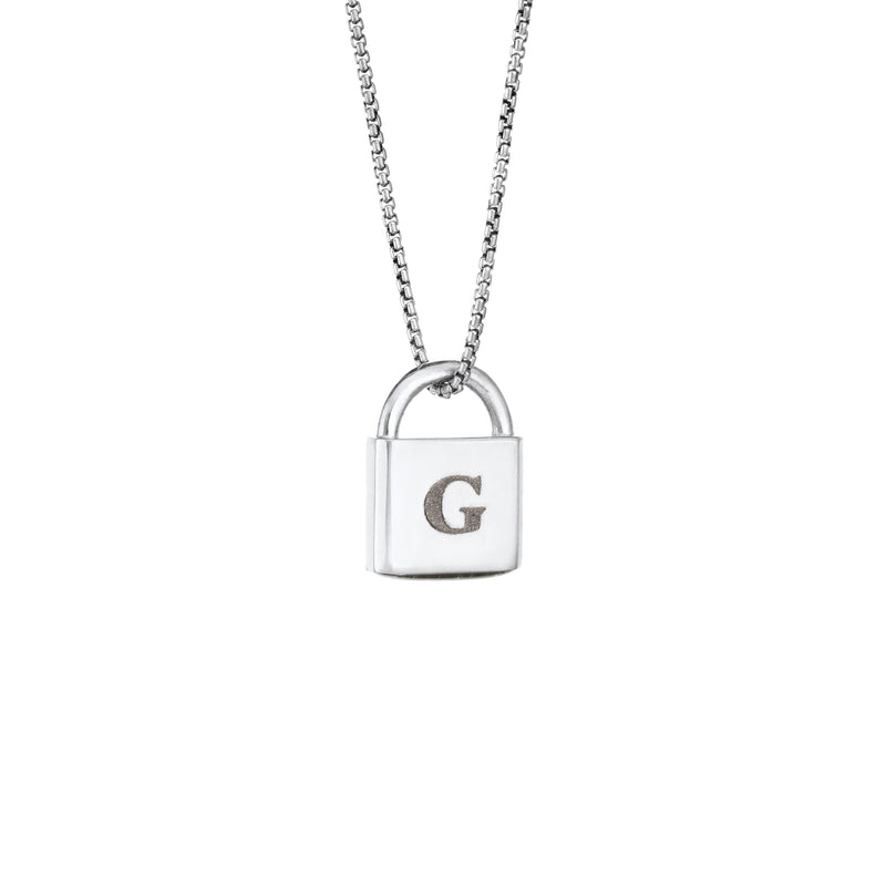A Lock-style Cremains Pendant with a capital "G" engraved on its front in 14K White Gold by close by me jewelry from the side