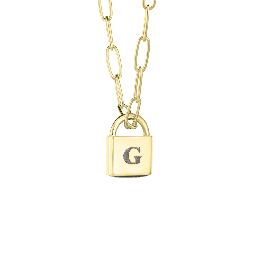 A Lock-style Cremation Necklace with a Stylized Chain with a capital "G" engraved on its front in 14K Yellow Gold by close by me jewelry from the side