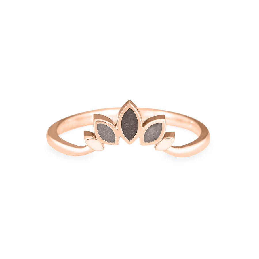 Front view of Close By Me's Lotus Cremation Ring in 14K Rose Gold against a solid white background. The large, center petal has a dark grey ashes setting, and the smaller petals on either side have medium-grey ashes settings.