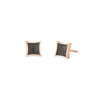 A pair of Close By Me's Luminary Stud Cremation Earrings in 14K Rose Gold set against a solid white background. A front view is shown for the left earring while the right earring is turned to show a side view.
