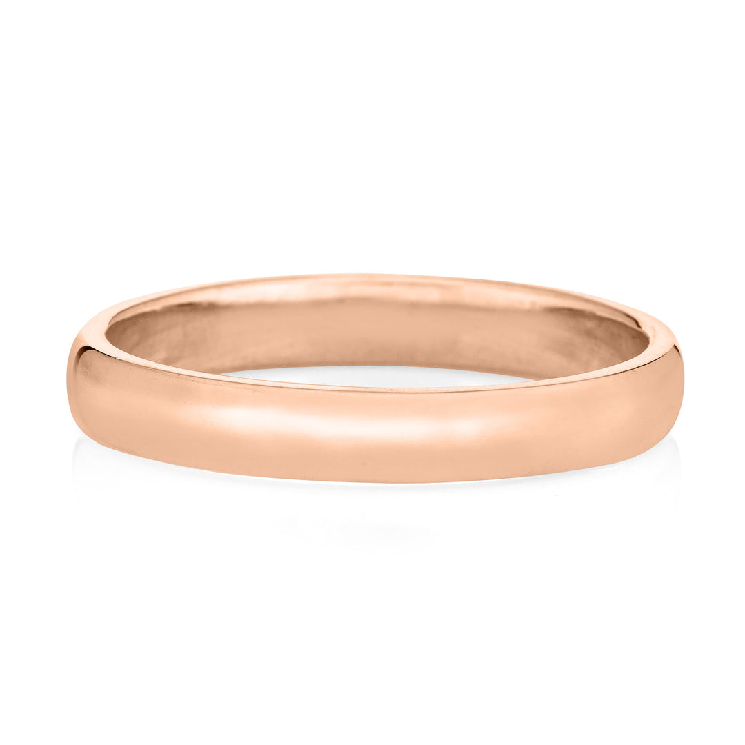 A 14k rose gold smooth band cremation men's ring from the back against a white background