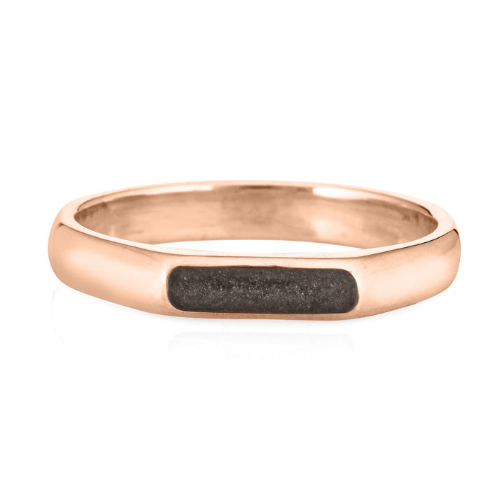A 14k rose gold simple mens memorial band with ashes from the front against a white background
