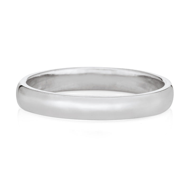 A memorial ashes ring with a simple design in 14k white gold on a white background