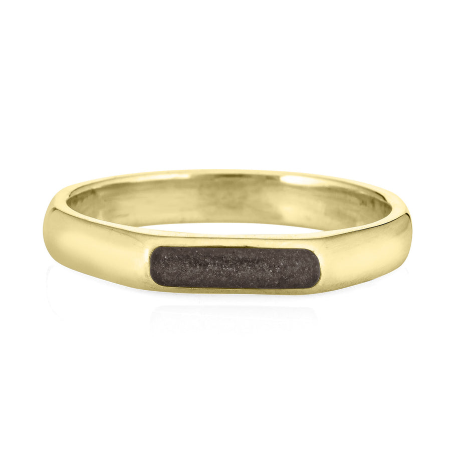 a 14k yellow gold smooth band memorial ring with ashes from the front on a white background