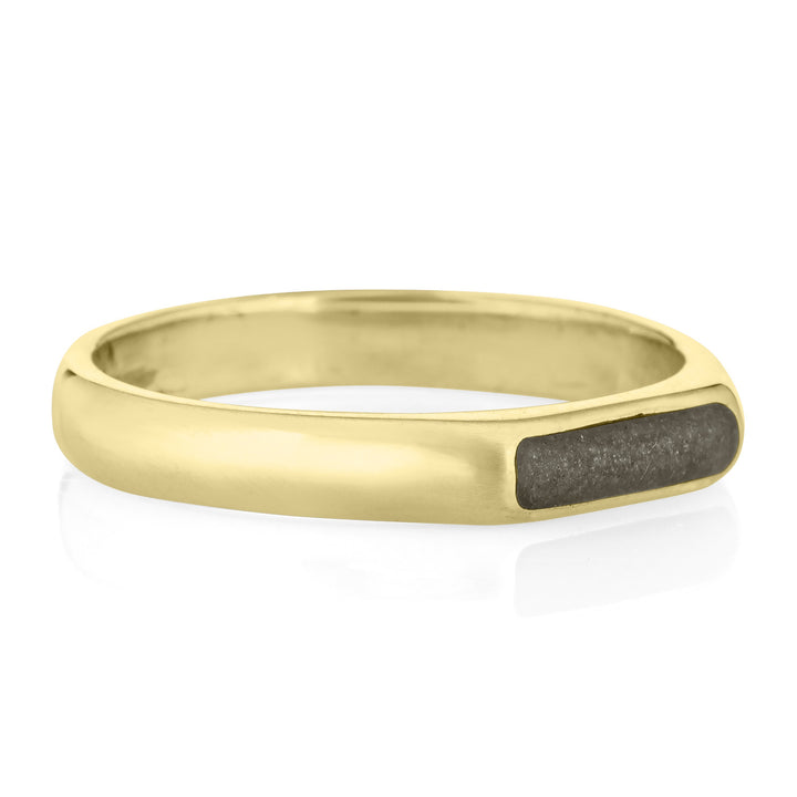 A 14k yellow gold ring from the side with a simple band design set with ashes by gina murphy of close by me
