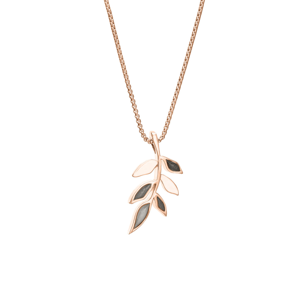 This photo shows the 14K Rose Gold Olive Branch Ashes Pendant designed by close by me jewelry from the side