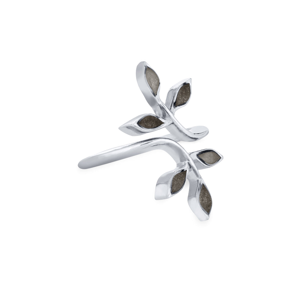 Pictured here is close by me jewelry's 14K White Gold Olive Branch Ashes Ring from the side to show the thickness of the casting and its multicolored cremation settings