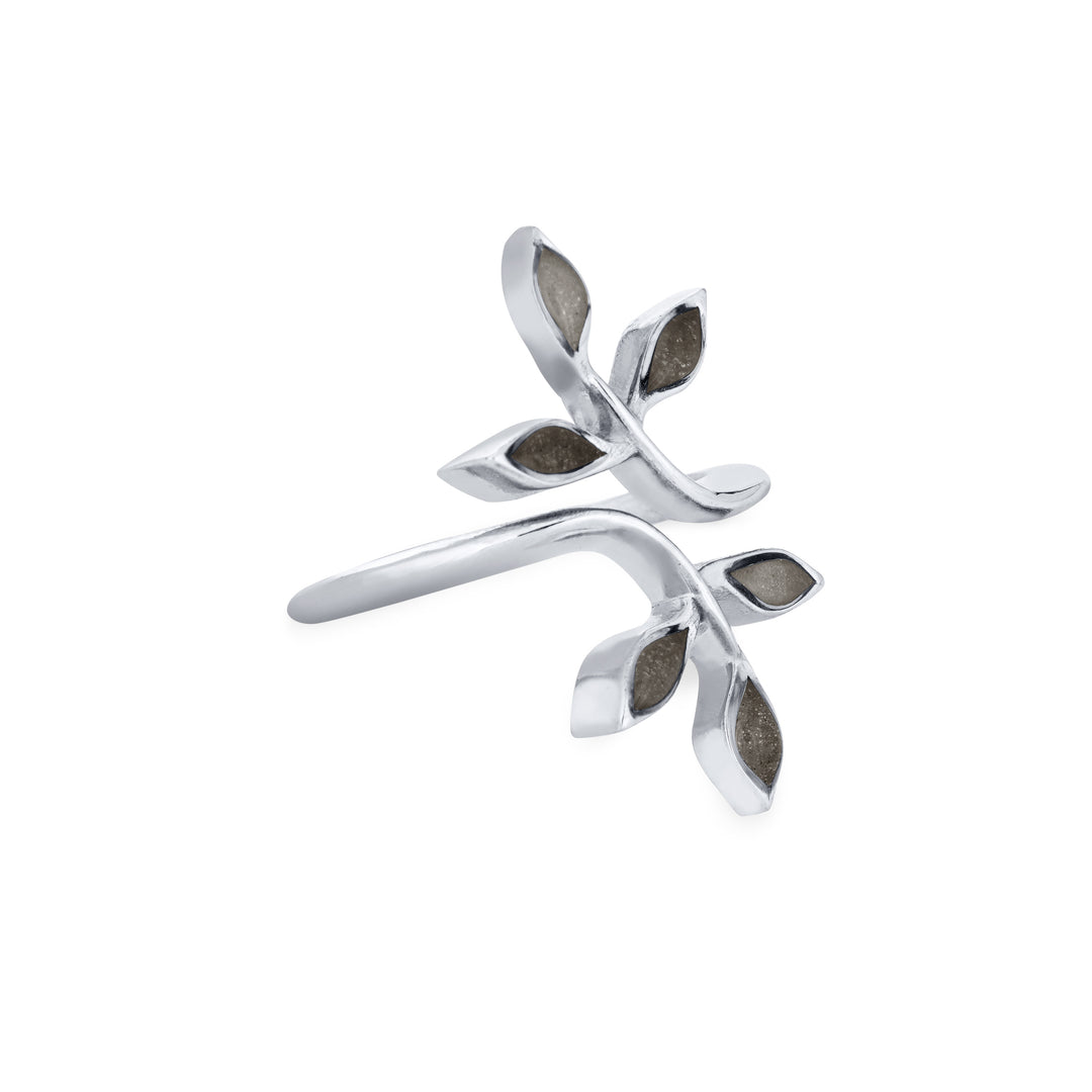 Pictured here is close by me jewelry's 14K White Gold Olive Branch Ashes Ring from the side to show the thickness of the casting and its multicolored cremation settings
