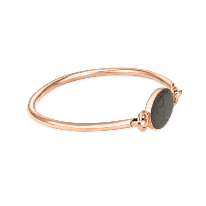 14k rose gold oval clasp cremation bracelet featuring solidified ashes shown from the side