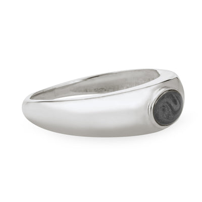 Close By Me Jewelry's Sterling Silver Oval Dome Cremation Ring resting flat and turned to the side, showing how its band tapers in width from around the oval-shaped ashes setting to the back.