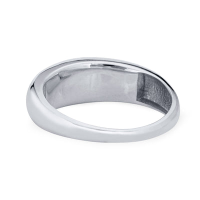 A close-up view of the back and inside of Close By Me Jewelry's Oval Dome Cremation Ring in 14K White Gold, which is laying flat against a solid white background.