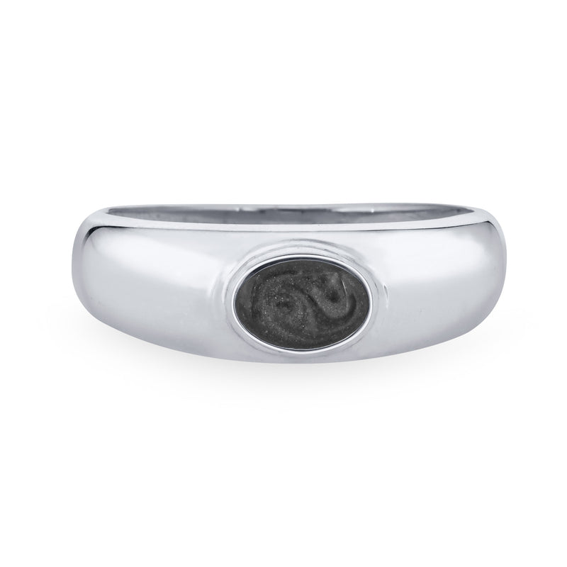 Centered against a stark white background, this 14K White Gold Oval Dome Cremation Ring from Close By Me Jewelry features an ashes setting that is dark grey in color with a subtle swirled pattern visible.