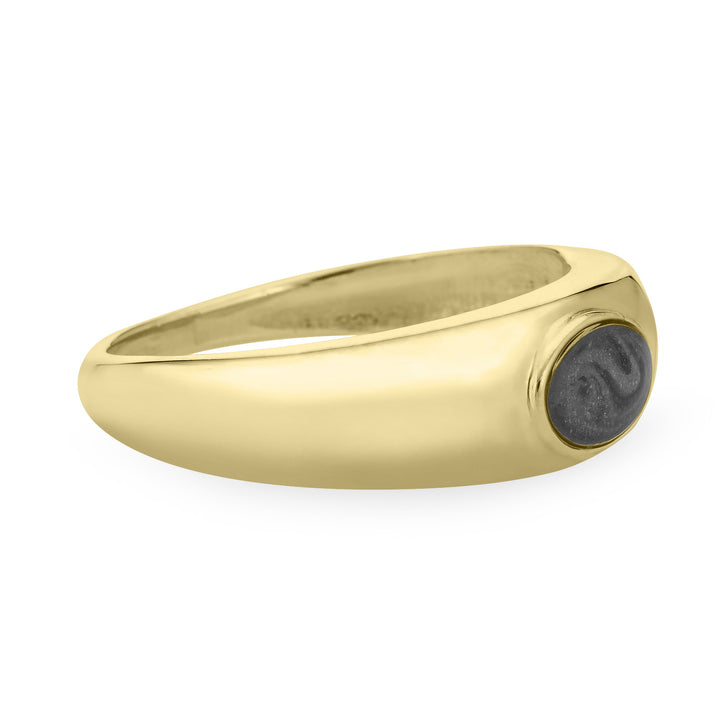 Close By Me Jewelry's 14K Yellow Gold Oval Dome Cremation Ring resting flat and turned to the side, showing how its band tapers in width from around the oval-shaped ashes setting to the back.