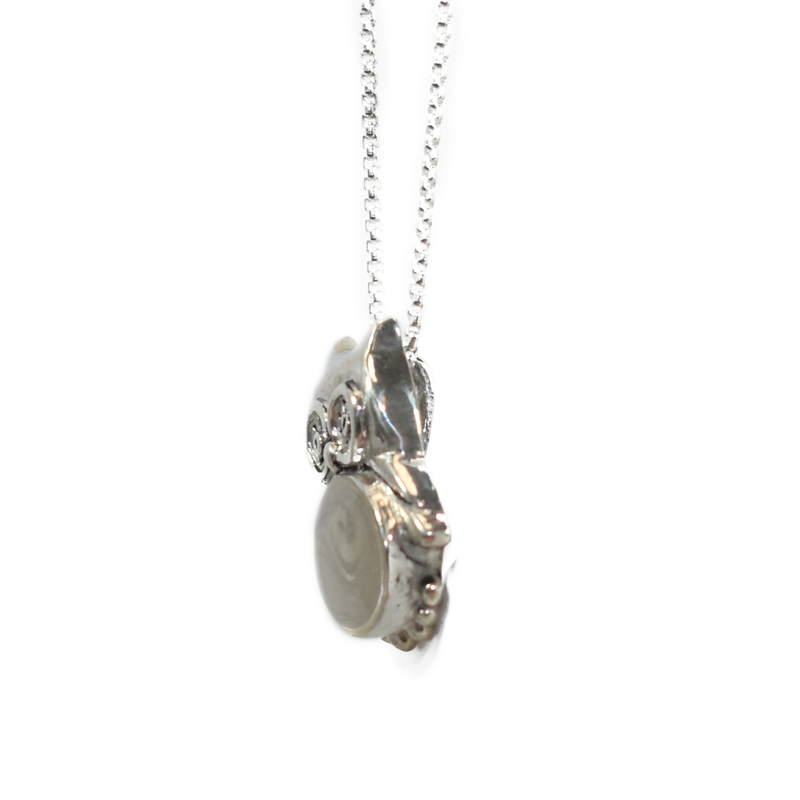 Pictured here is the Owl Cremation Pendant design in Sterling Silver, created and set with ashes by close by me jewelry, from the right side