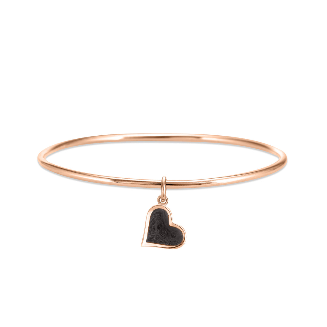 14k rose gold single bangle cremation bracelet with dainty heart ashes charm shown from the front