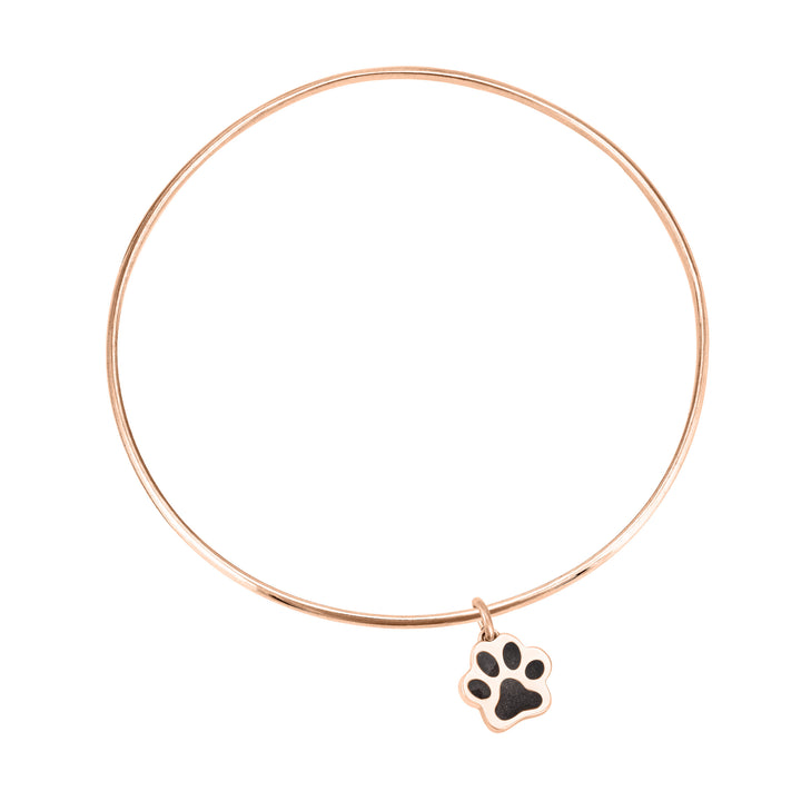 14k rose gold single bangle cremation bracelet with paw print ashes charm shown from the top