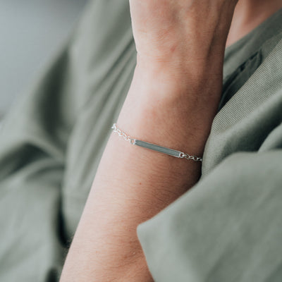 Sterling Silver Thin Lateral Bar Cremation Bracelet shown on the arm of a model