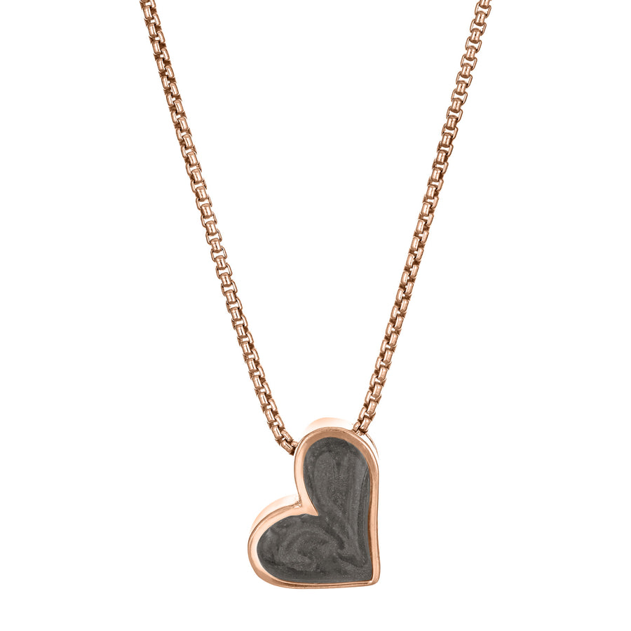 The Signature Sliding Heart Cremation Pendant in 14K Rose Gold and set with ashes by close by me jewelry from the front