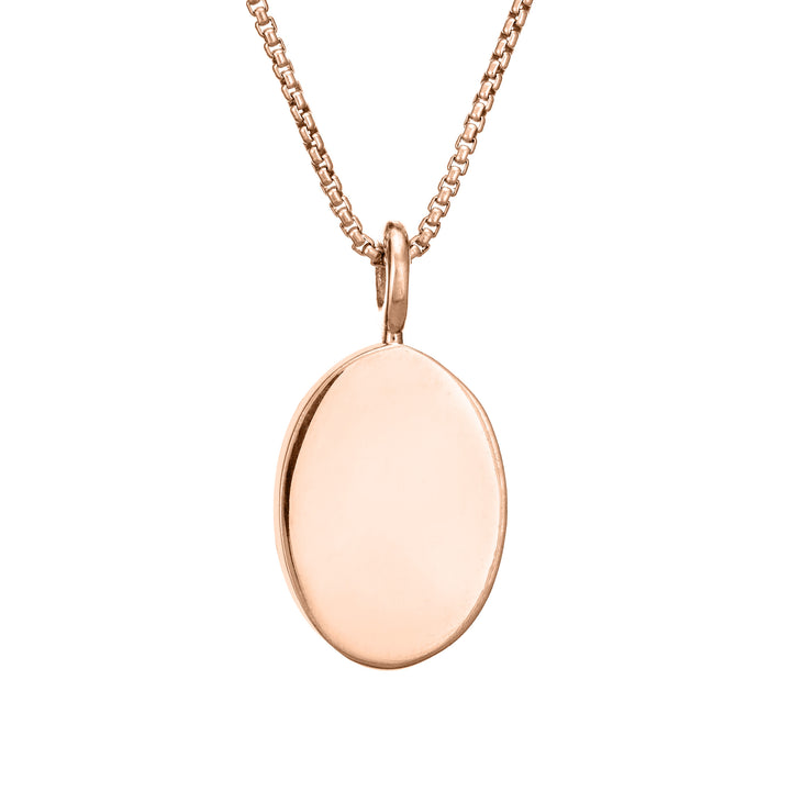 The simple bail oval pendant with ashes by close by me jewelry in 14k rose gold from the back
